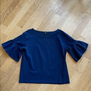 JCrew // structured navy top with peplum sleeves